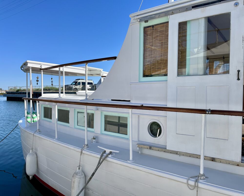 Toward the stern from the starboard side.
