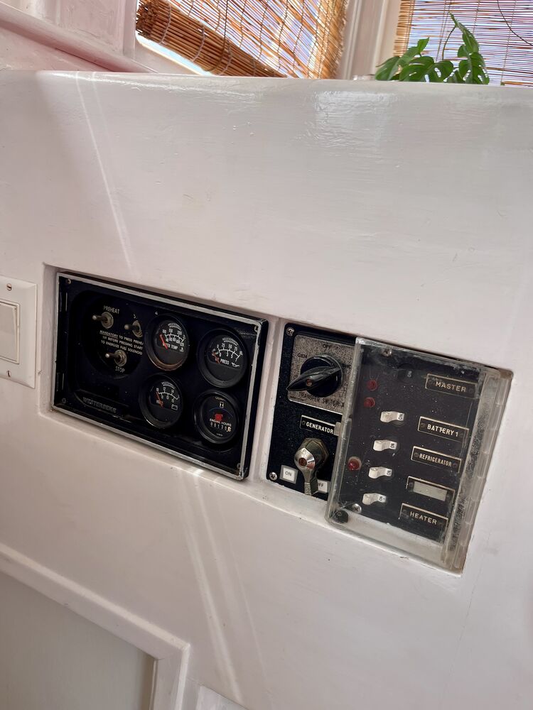 The Westerbeke generator and AC power control panel.