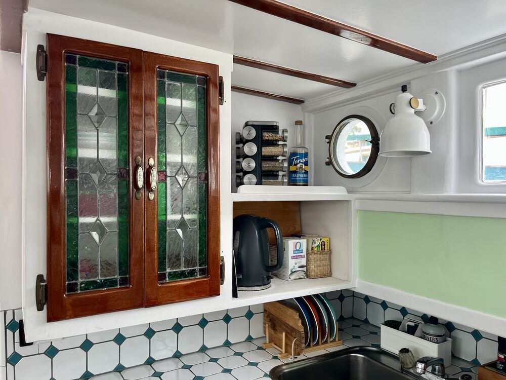 The galley with stained-glass cabinet doors.