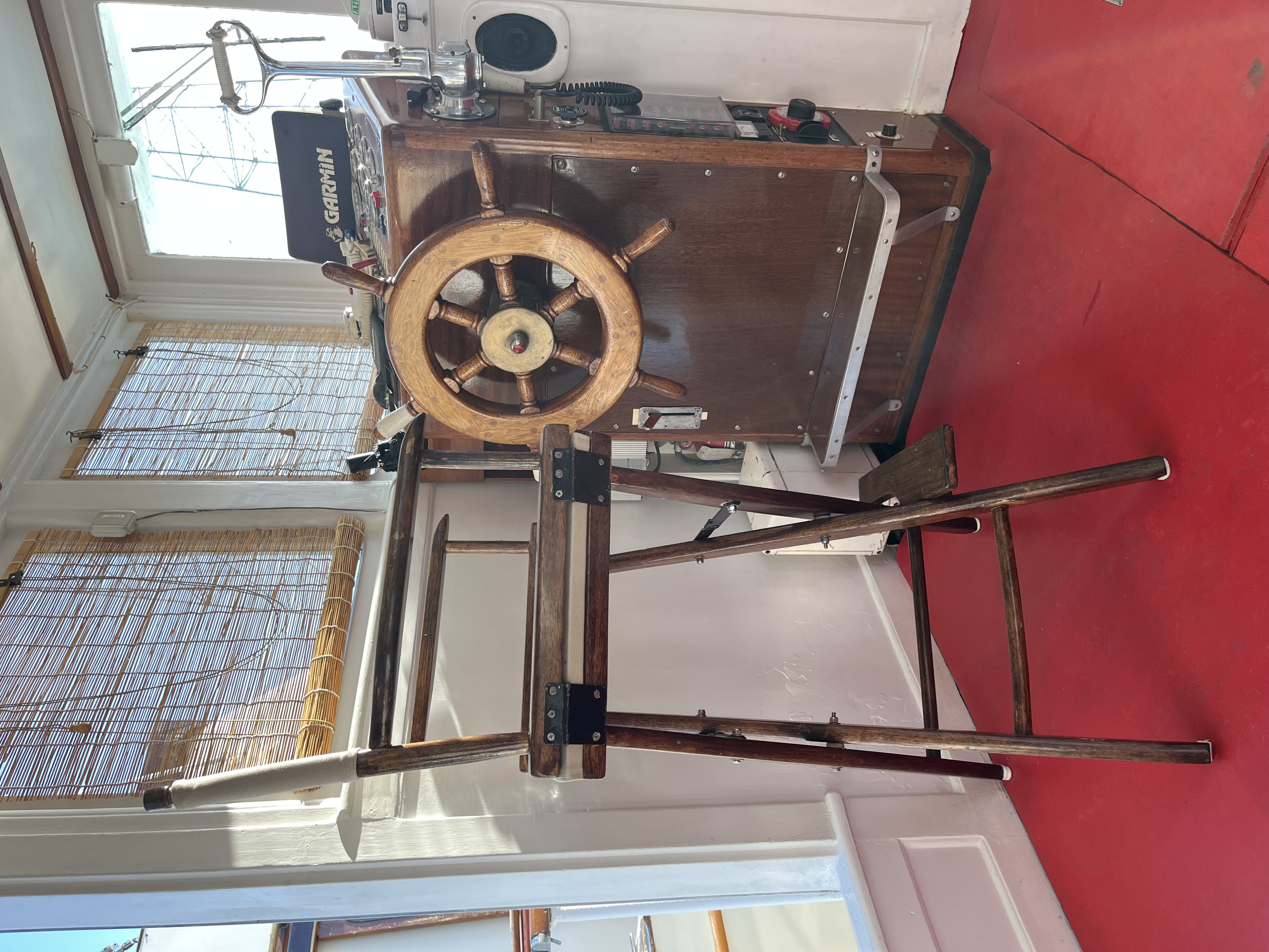 The helm with wheel and instrument panel.